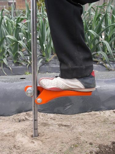 SUN-A G32 foot-operated pipe step used in a greenhouse